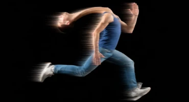 Person running so fast that the head is behind the body.